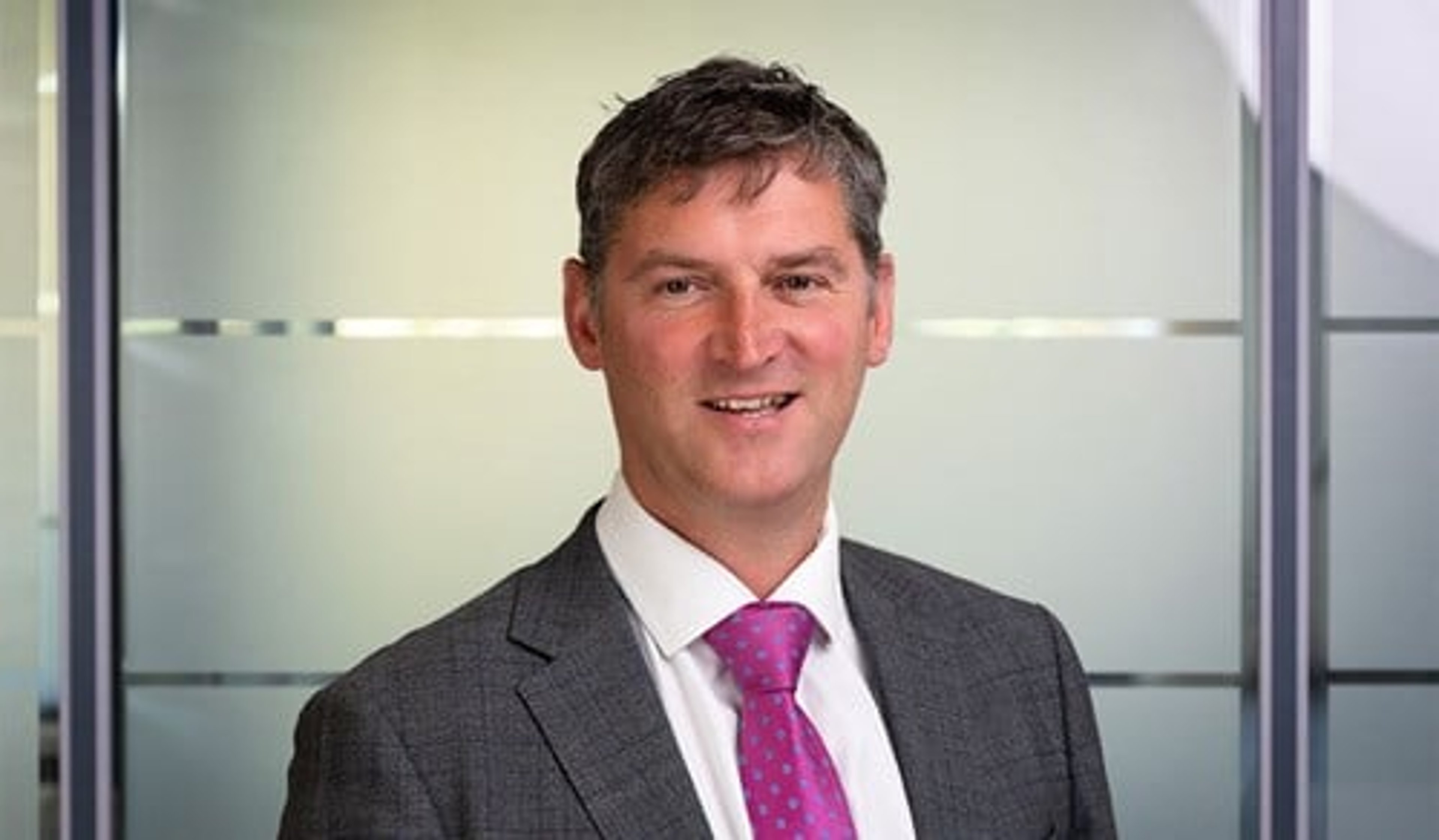 A headshot of Graeme Reid